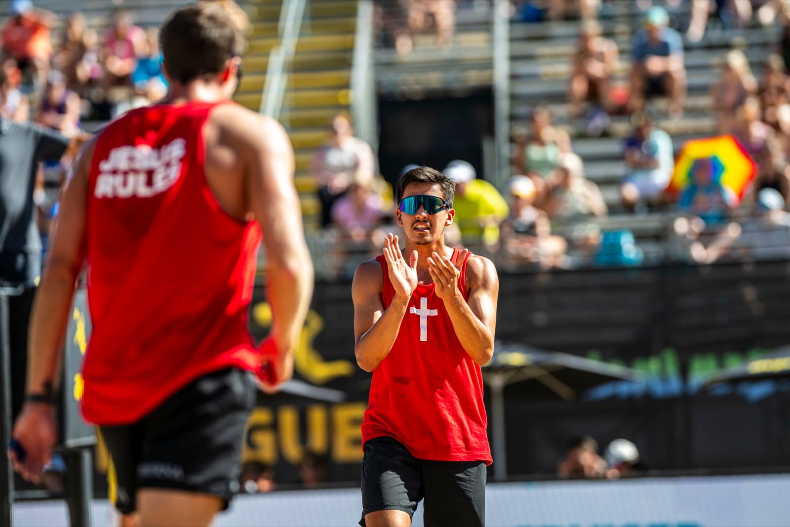 Diego celebrating with fans at AVP tournament
