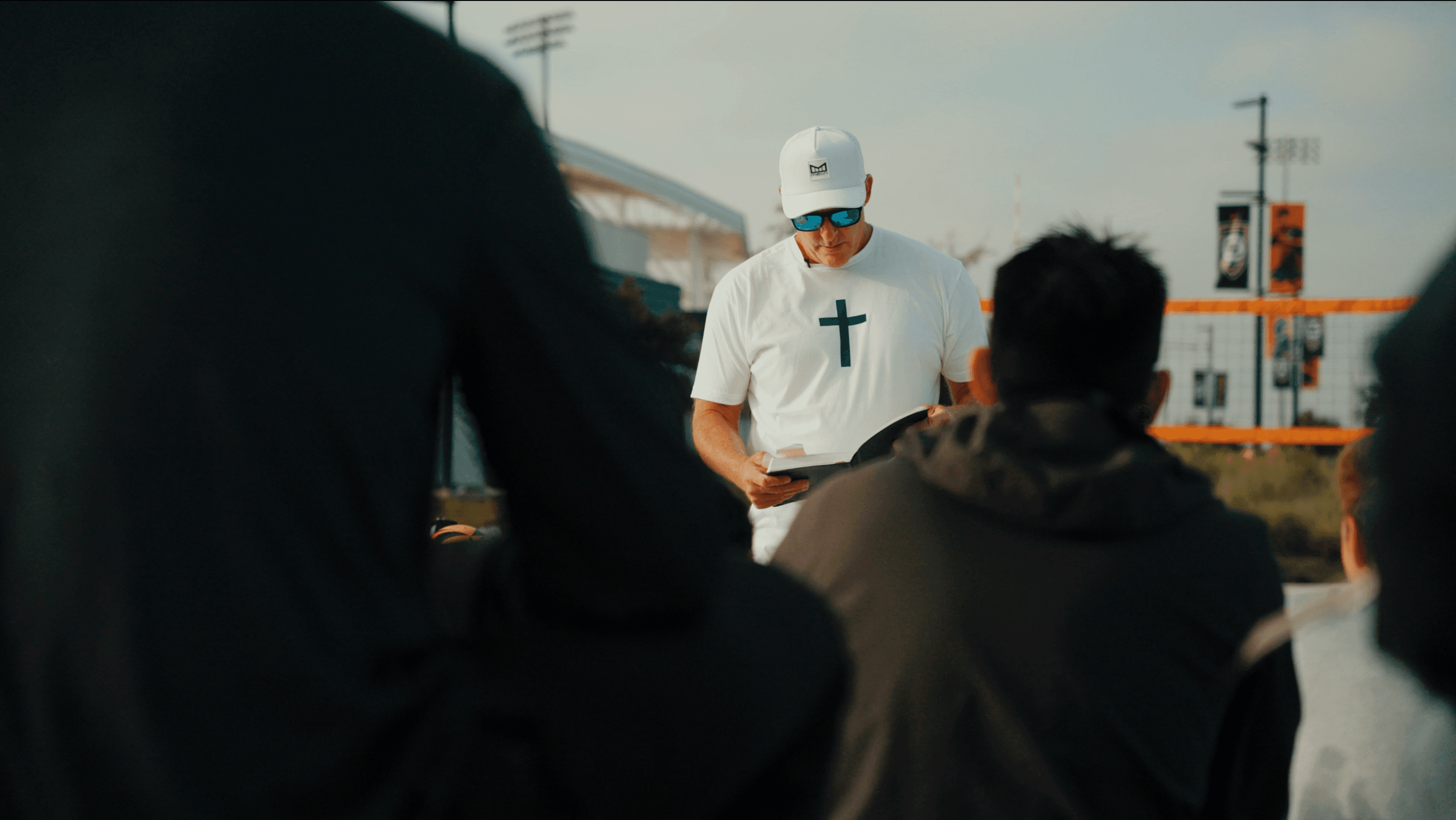 Michael speaking to group at tournament