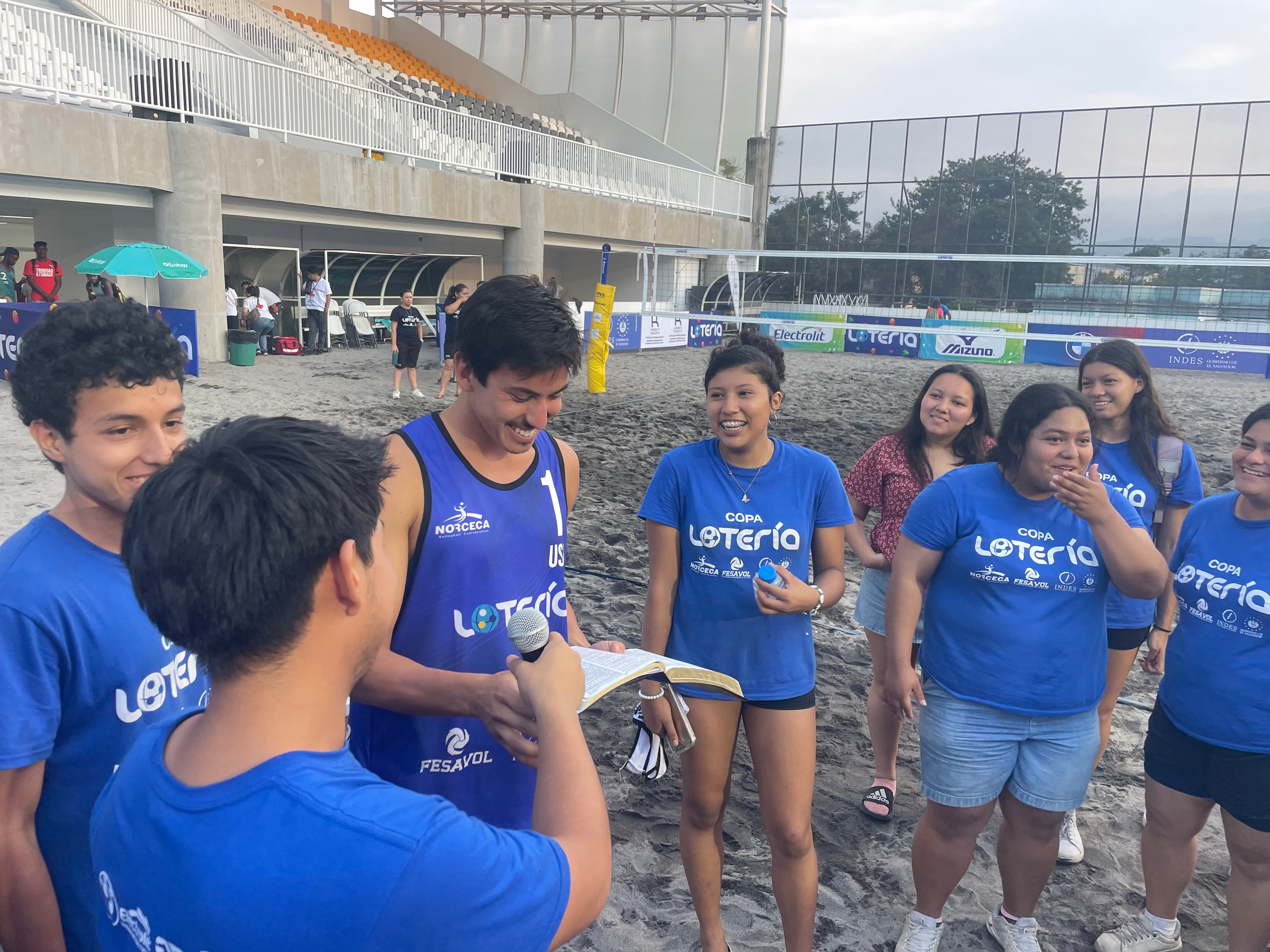 Diego at a beach volleyball clinic with Salvadoran youth